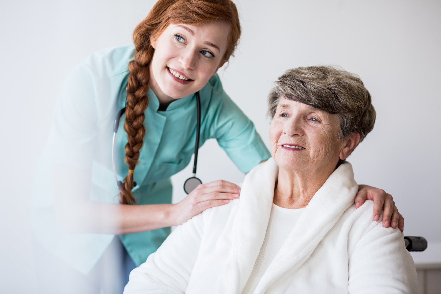 Young doctor and enderly patient